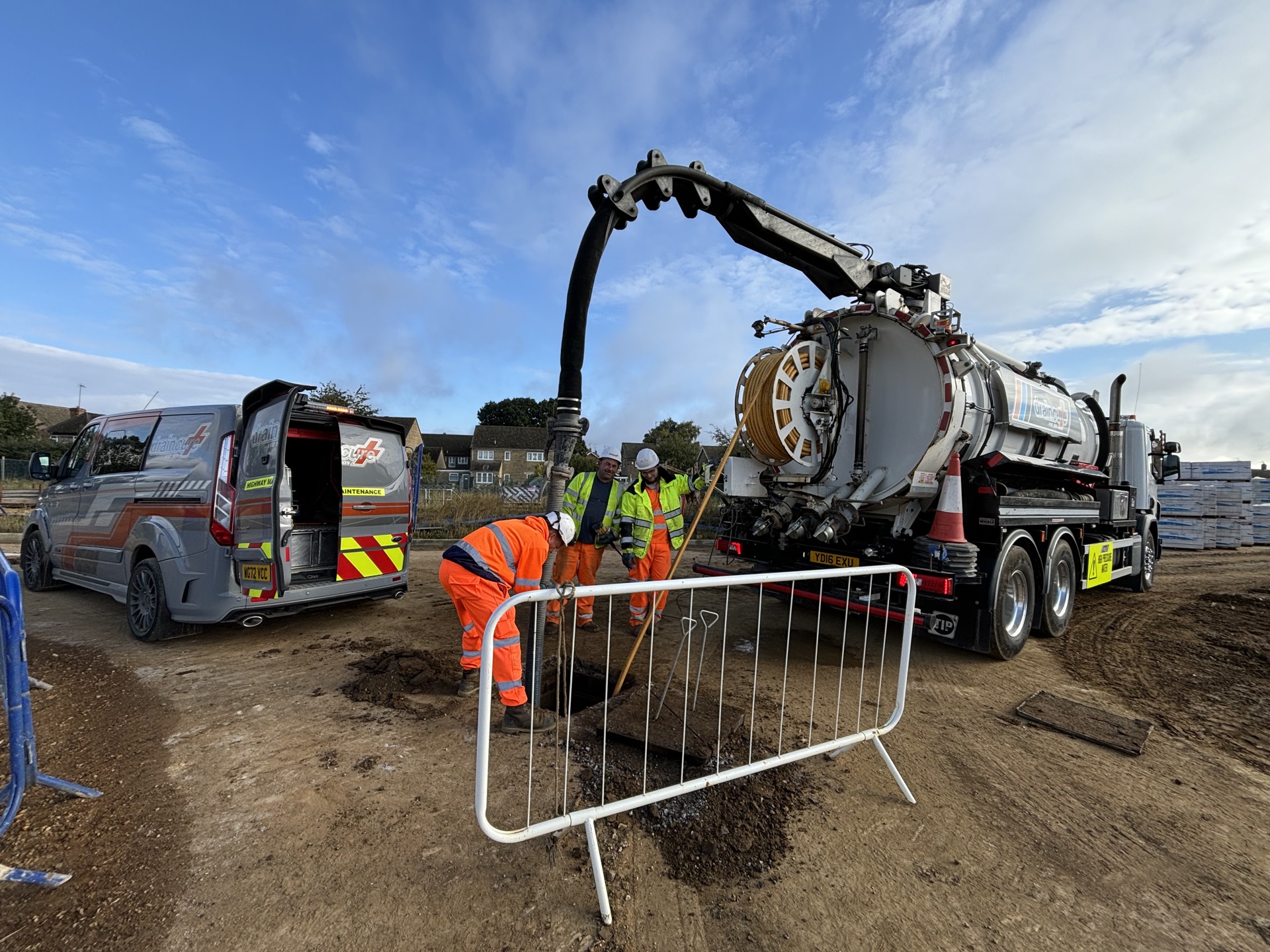 Draincure & Son crew carrying out deep manhole cleansing on a commercial site